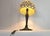 Unique table lamp made from cementyed seashells. The base is an art nouveau style metal base, which combines nicely. The...