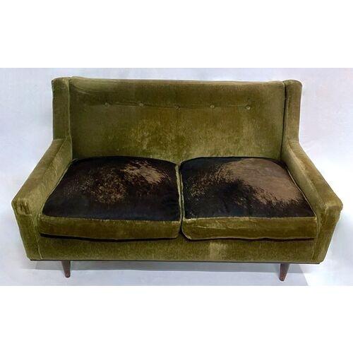 Vintage mohair velvet and cowhide loveseat with two cowhide and mohair seat cushions. Tufted inside back detail. No...