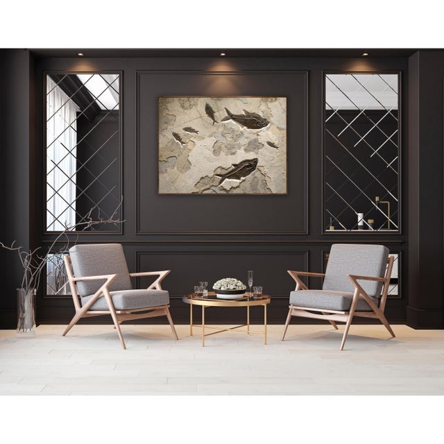 This fossil fish mural features three Diplomystus dentatus and three Knightia eocaena in a richly hued limestone. The deep...