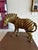 A beautifully crafted vintage woven zebra sculpture featuring hand-woven wicker construction with graphic black lacquer...