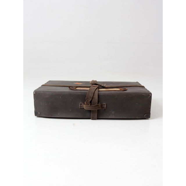 A vintage 1920s vulcanized fiber parcel post case by P. Becker & Co. of Chicago, finished in rich dark brown with woven...