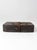 A vintage 1920s vulcanized fiber parcel post case by P. Becker & Co. of Chicago, finished in rich dark brown with woven...