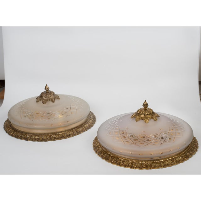 Vintage pair of brass & heavy etched glass with cut patterned etchings flush mount light fixture. Spain, circa 1950s....