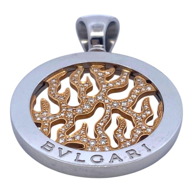 Vintage Bulgari Tondo Fire pendant, featuring a yellow gold flame motif in the center pave set with round brilliant cut...