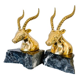 1970s Hollywood Regency Brass Gazelle / Antelope Head Bookends on Raw Edge Marble Bases - A Pair For Sale