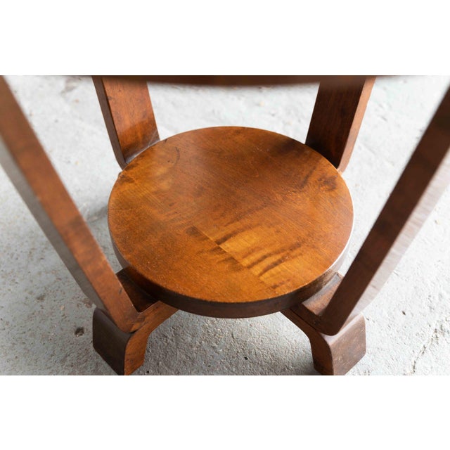 Elegant occasional table, designed and produced in the Netherlands in the 1930s. The two‑tier frame is mainly crafted from...