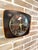 Original vintage wall clock produced by the historic french brand jaz, featuring a square case with rounded corners, a...