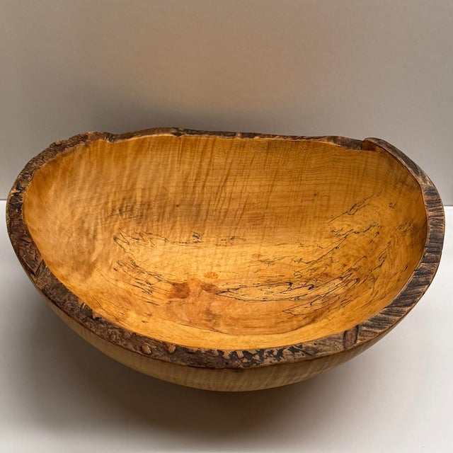 Embrace the charm of New England craftsmanship with this handcrafted Live Edge Spalted Maple Bowl by Spencer Peterman,...