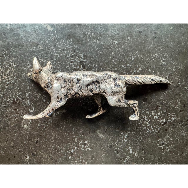 Circa late nineteenth/early twentieth century silver animal figure, likely German. Fox is in a stalking position, mid-...