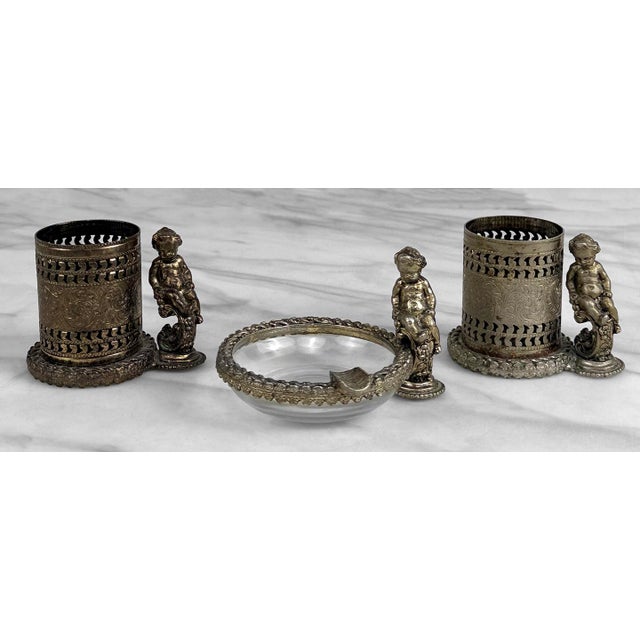 A Victorian Rococo Metal Filigree Cherub Ashtray & Holder Smokers Set, c. Mid 20th Century - Includes 1 Glass Ashtray & 2...