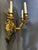 pair of circa 1920’s gilt bronze French Empire sconces with swan head holding a ring with 3 lights