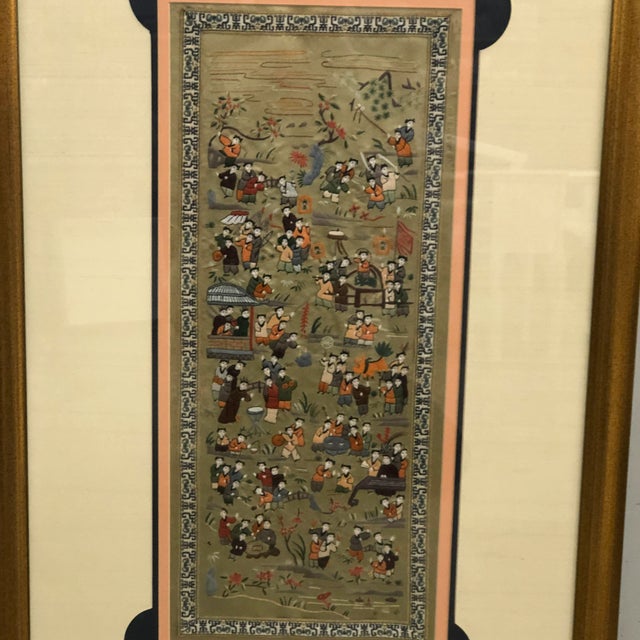 Framed Chinese Silk Embroidery "100 Children Playing". This beautiful picture is a picture of one hundred children...