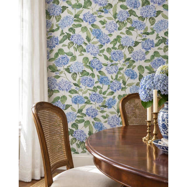 Our Hydrangea Blooms Botanical Wallpaper began as a hand-painted watercolor, with each petal added one by one to capture...