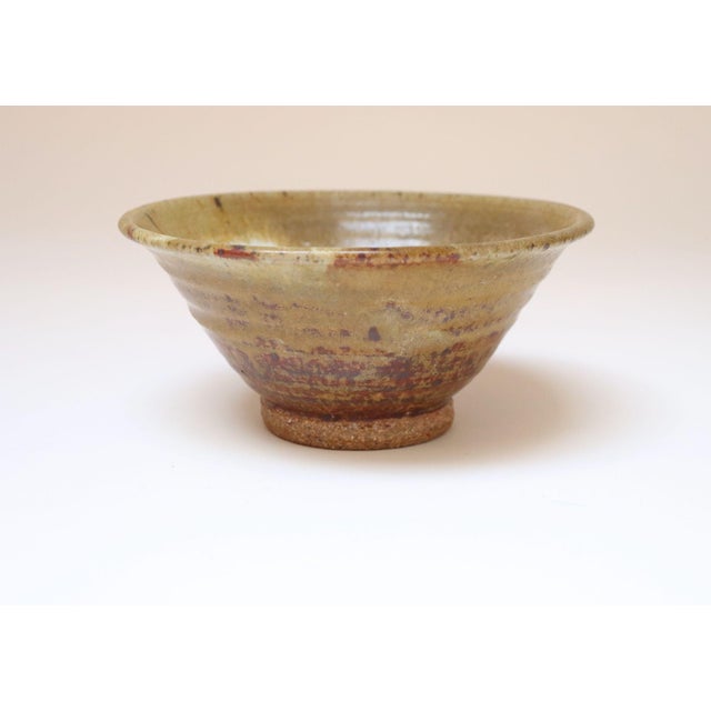 Small round studio ceramic bowl by ceramicist, Deanna Nichols (b. 1942-2017, Missouri). Holding a BFA from Kansas City Art...