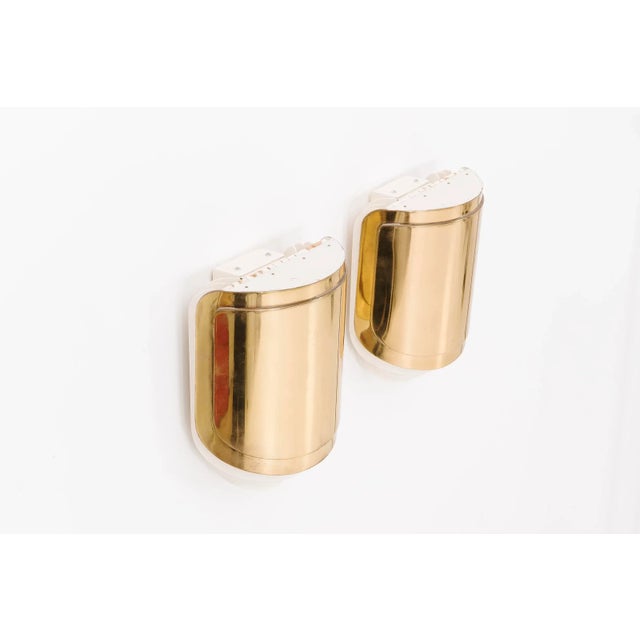 Warren Platner Associates commission for private residence. Custom wall sconce with lift-up brass shield with three steel...