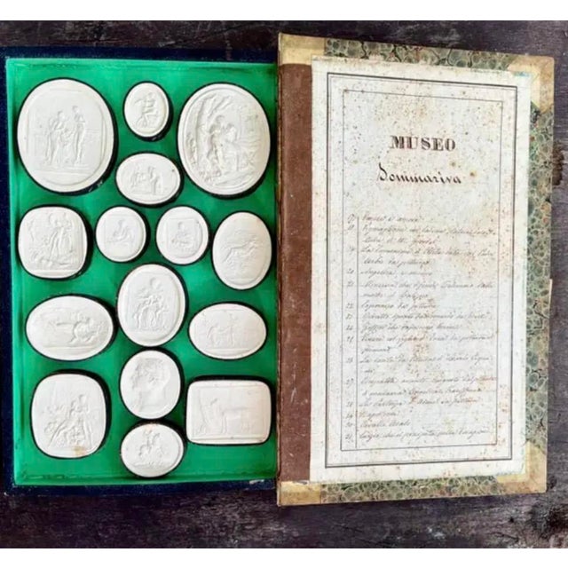 Beautifully preserved Grand Tour book-form box housing a collection of thirty-one classical Intaglio Medallions by...