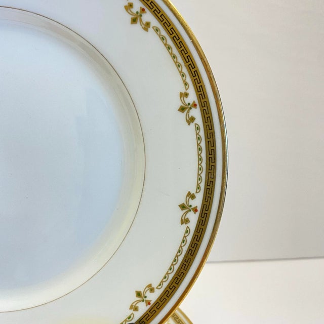 An elegant set of five antique Bernardaud / B&C Limoges dessert plates, finely decorated with a crisp Greek key border,...