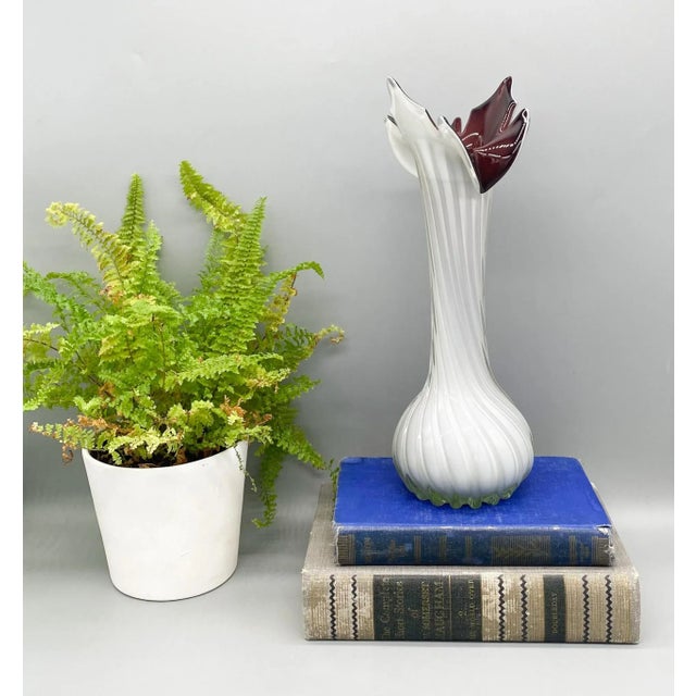 Stunning piece with an unusual design from the mid-late 20th century. Made in a Murano style with a transparent twisted...