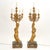 An impressive and highly decorative pair of 19th-century gilded bronze ormolu six-light figural candelabra, showcasing...