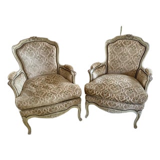 Louis XVI Style Distressed Cream Painted Bergere Chairs - A Pair For Sale
