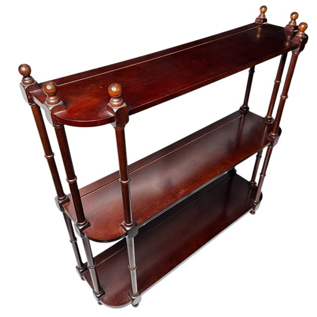 Light elegant 20 th c mahogany three tiers wall etagere display case. Can be placed on a wall or be a freestanding piece....