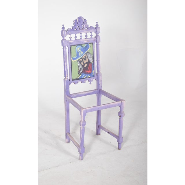 Painted dining chair with pirate figure and eye. High back in carved wood, intervened with contemporary painting in violet...