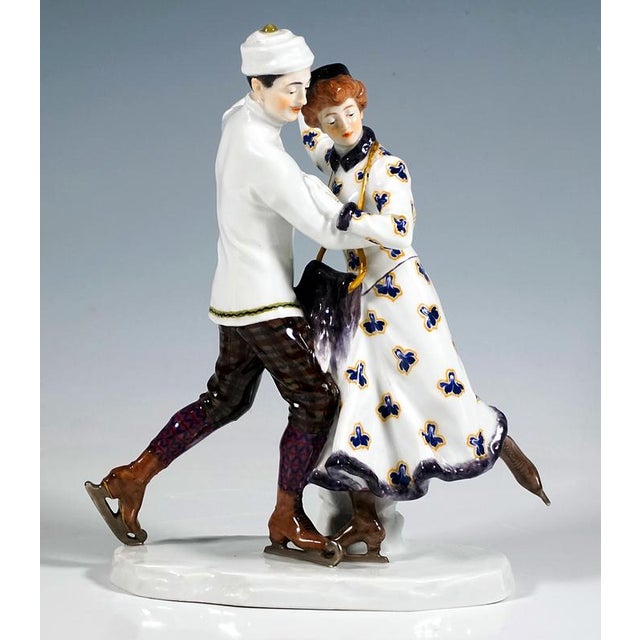 Delicate meissen art nouveau porcelain group: a couple skating in elegant winter attire: the lady in a suit with a long...