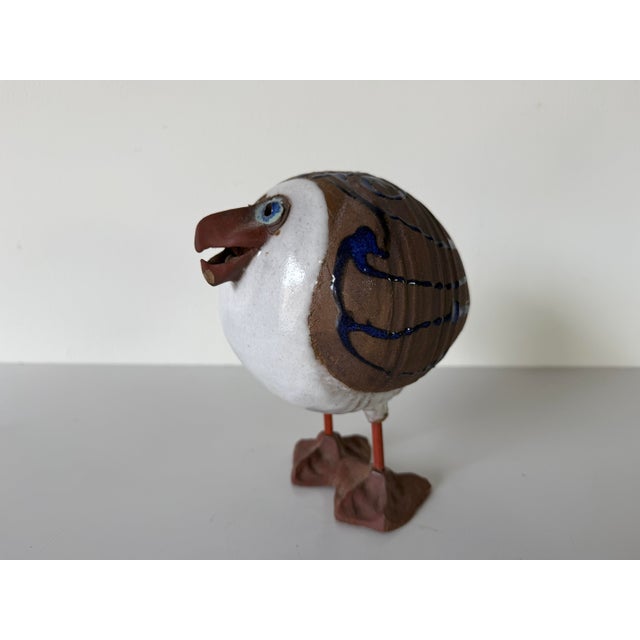 A charming handcrafted art pottery seagull sculpture by Cape Cod artist Susan Davis, featuring a whimsical folk art design...