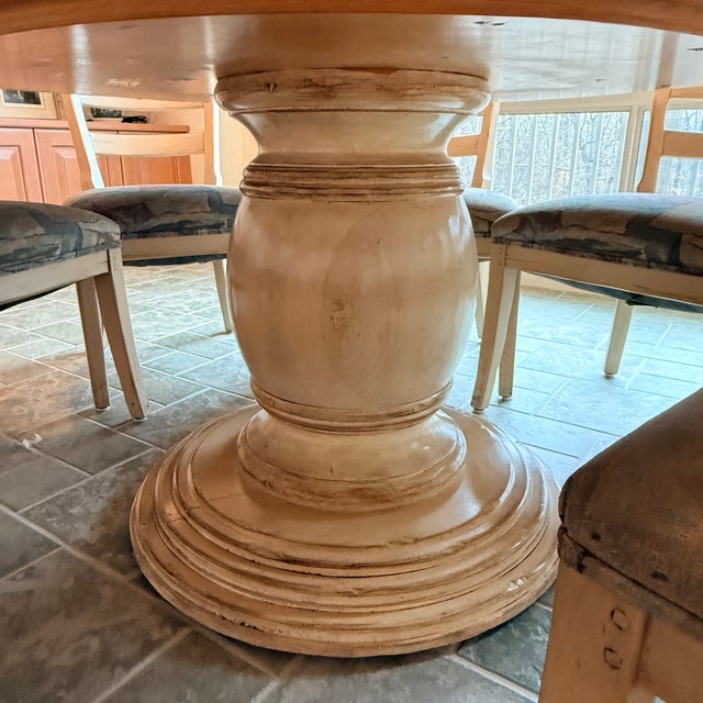 Large Round Kitchen Table with 8 Chairs A pedestal round table is perfect for large family gatherings—this set includes a...