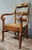 Empire-style armchair in solid walnut with a woven straw seat, in a rustic/provincial style (like a nursery chair or...