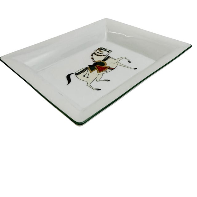 Made in a classic Hermes style, this exquisite vide poche / catchall tray is crafted from world-renowned Limoges porcelain...