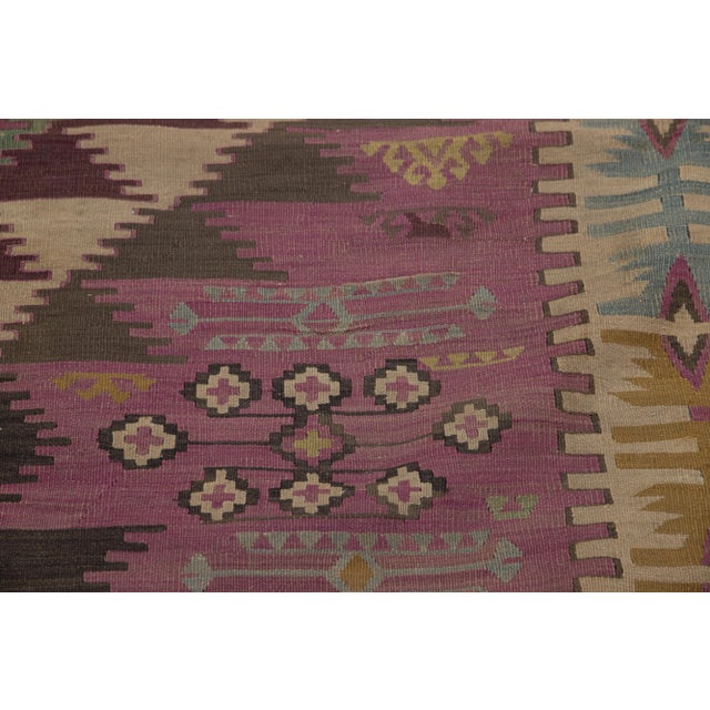 Vintage Kilim hand-knotted wool runner with a light blue color field. This piece has multicolor accents in an all-over...