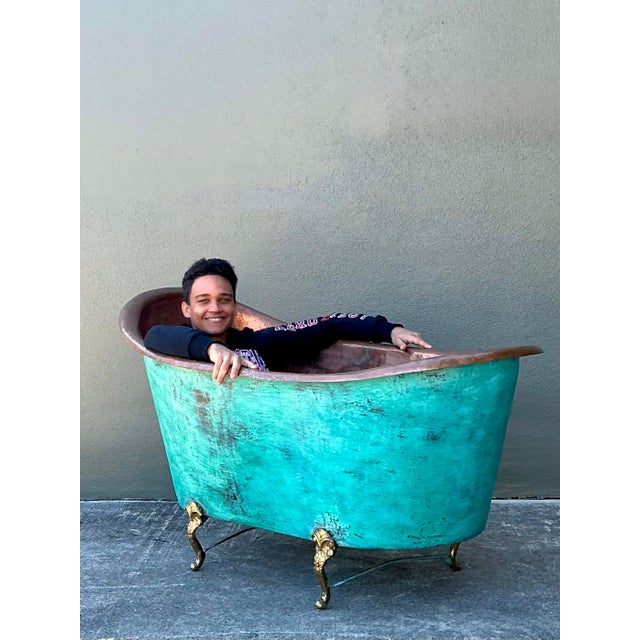 This monumental antique French-style bathtub is a breathtaking example of 19th-century artisanal metalwork and "Old World"...