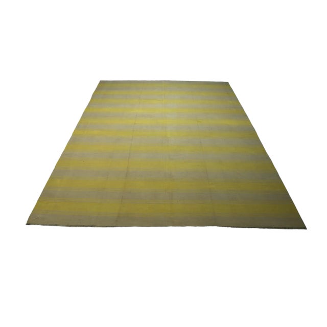 This vintage 7x9 Dhurrie flat weave is an exciting new entry in Rug & Kilim’s esteemed collection. Handwoven in wool, it...