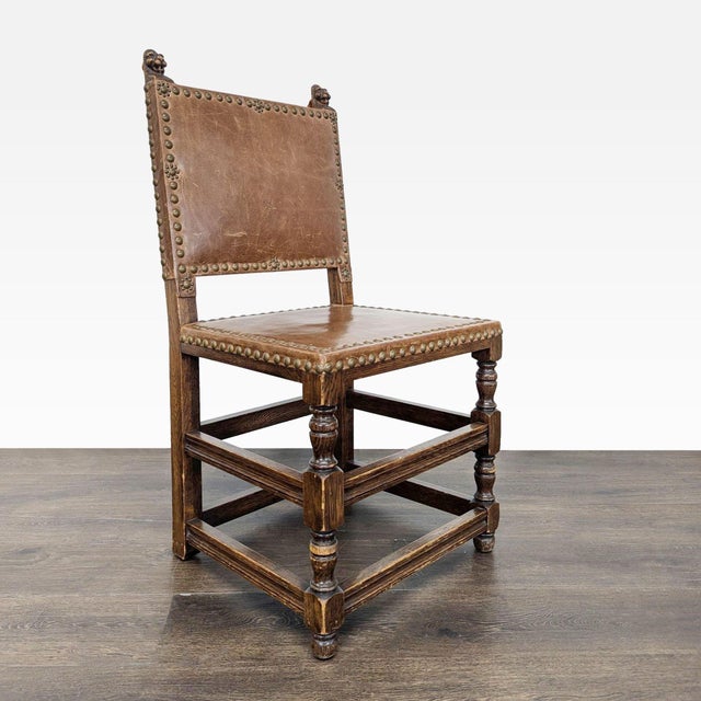 Dining chair with carved finials and nailhead trim. Dimensions (in): 20W x 17D x 38H.