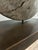 Exceptional primitive statement artifact featuring a heavily weathered antique hardwood wheel. The heavy block base is...