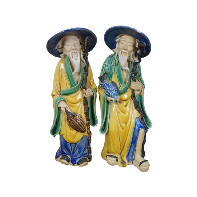 Set of 5 vintage 20th century Chinese ceramic "mud man" figurines. Wise looking men with long white hair, dressed in...