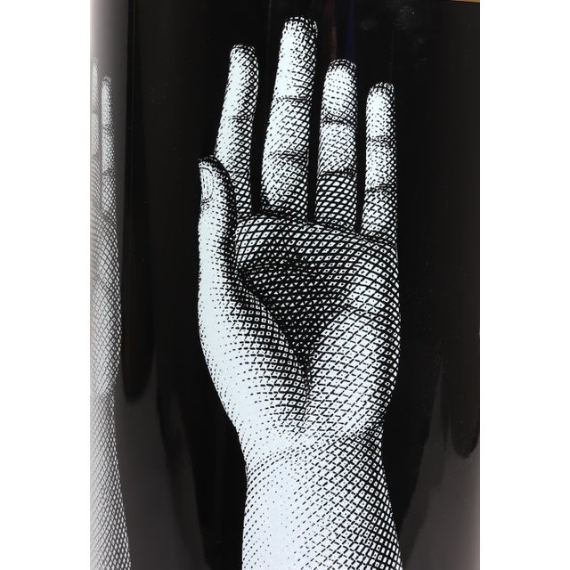 Fornasetti Studio Mani Umbrella Stand, Signed & Dated 2007 The Fornasetti cylindrical umbrella stand is decorated with the...