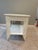 This antique wicker library table offers timeless appeal. Its intricate woven design and white finish create a...