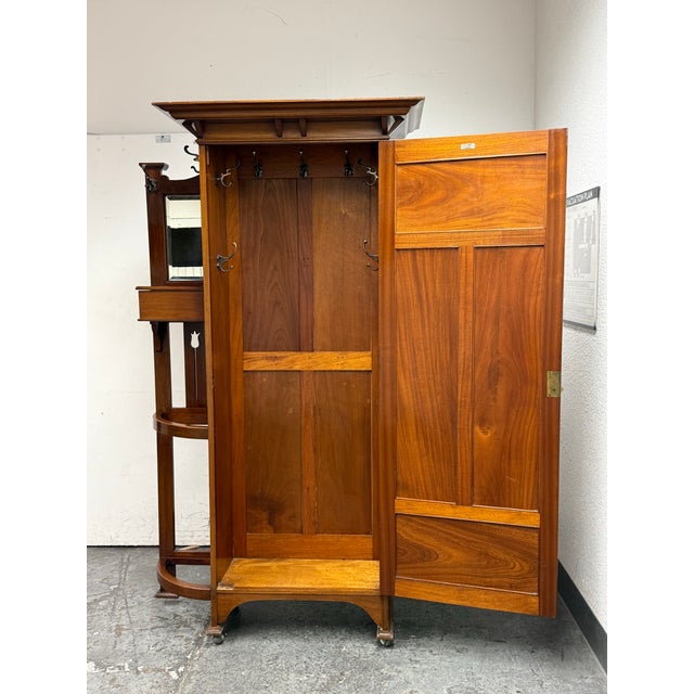 Design Plus Gallery presents an Antique Hall Wardrobe from J. & J. Shaw. This early 20th century piece pairs a single-door...