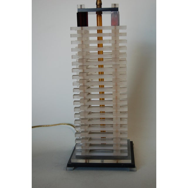 Bespoke hand-made Mid-century stacked Lucite table lamp featuring a black Lucite base with stacked polished blocks stacked...