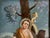 A one-of-a-kind antique, hand-painted, reverse painting on glass depicting Saint John the Baptist as a child, shown with...