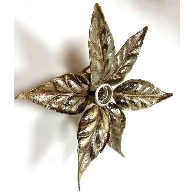 Very nice brass flower wall light, designed by Willy Daro and made in Belgium by Light Company Massive in the 1970s. This...