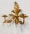 Glamorous Hollywood Regency style pair of vintage Italian gilt metal sconces with crystals. Each sconce features a myriad...