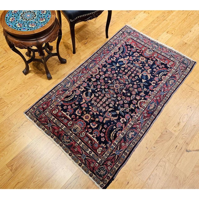 2’ 11” x 5' Vintage Agra rug in allover floral pattern in navy Blue and red colors from the early 1900s. This antique Agra...