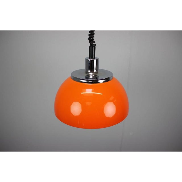 A striking original faro pendant light designed by harvey guzzini, dating from the 1970s and manufactured by meblo in the...