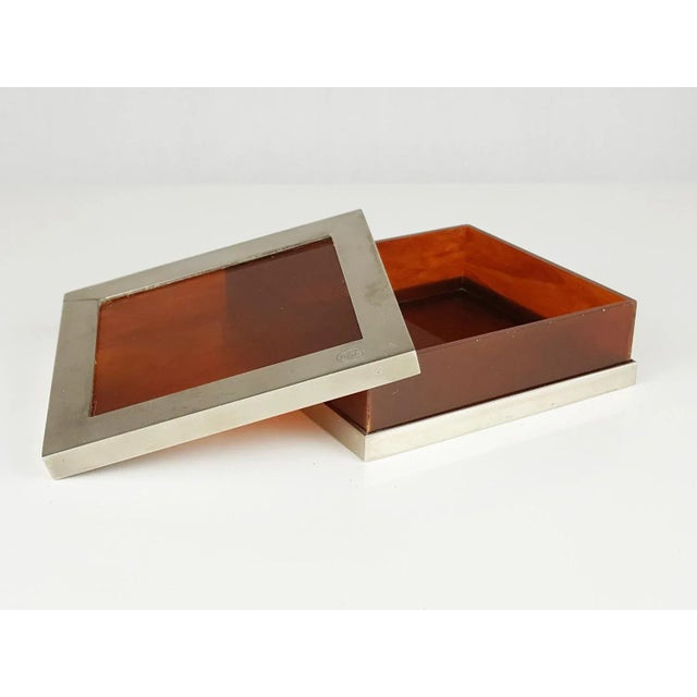 This metal & plastic box was produced in the 1960s. It is made from nickel plated brass frame and plastic faces. the box...