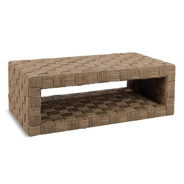 Handwoven seagrass coffee table crafted over a sturdy mahogany frame, featuring a striking basketweave texture and open...