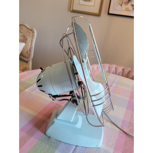 This baby blue 1950s vintage Montgomery Ward 10-in oscillating desk fan most likely was manufactured by Knapp-Monarch in...