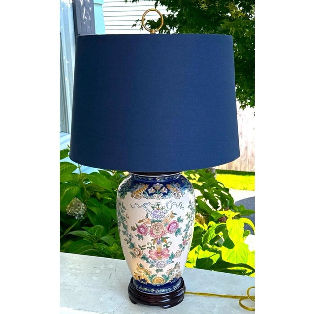 Pair of Hand-Painted Chinese Porcelain Table Lamps A graceful duo of vintage Chinese porcelain table lamps, each mounted...